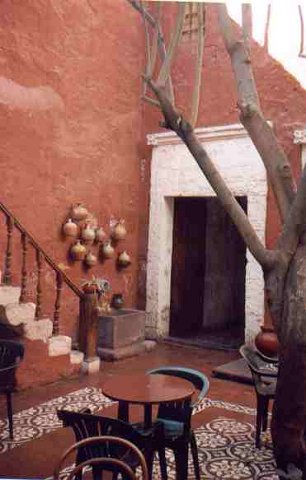 Our Arequipa hotel was fantastic!  It suffered the usual Peruvian water problems (no pressure and unpredictable hot water) but the architecture reminded of and old castle.  Nearly everything in Arequipa was constructed of huge, white stone and our hotel was no exception.  Note the stone on the inside of our room in the following pictures.