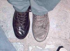 That evening in Cusco Terry decided to buy some finger puppets from one of the children on the  street.  As she negotiated for puppets I decided to finally let one of the kids shine my boots.  He hadjust waxed up one boot when all the kids started yelling that the police were coming and they scattered.  We were left with unfinished shoe shines and hand full of unpaid for puppets as riot gear equipped police entered the plaza.  We later found that it was not allowed to sell on the plaza, only on the side streets.  After several minutes we left he plaza and the kids reappeared to get payment for their puppets.  I found anothe young man to finish my shoe shine.  I was so impressed with what he did with my crummy old boots that I took a picture to show how fine the boot looked compared to the other, unpolished one.(Click to enlarge)