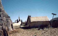 Many of the villagers have recently acquired solar panels.  We visited one hut and the owner was very proud of her battery power boom box and small black and white tv.(Click to enlarge)